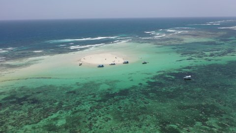 sandbank with white sand and boats around small island Drone view Coastline Diani beach landscape Kenyan African Sea  aerial 4k indan ocean tropical mombasa turquoise white sand East Africa paradise