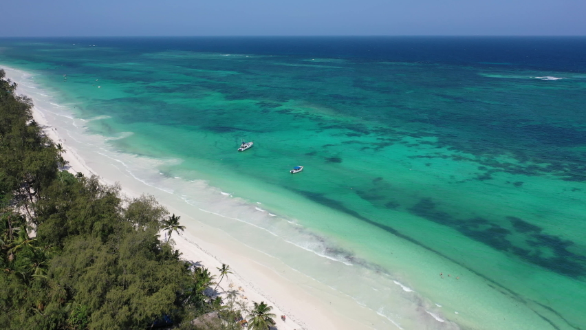 palms in Diani beach Kenyan coast African Sea drone aerial 4k waves blue indan ocean tropical mombasa turquoise white sand East Africa paradise view Kenya landscape  Royalty-Free Stock Footage #1087847673