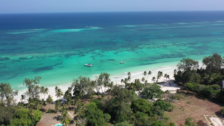 Palms in Diani beach Kenyan coast African Sea drone aerial 4k waves blue indan ocean tropical mombasa turquoise white sand East Africa paradise view Kenya landscape  | Shutterstock HD Video #1087847673
