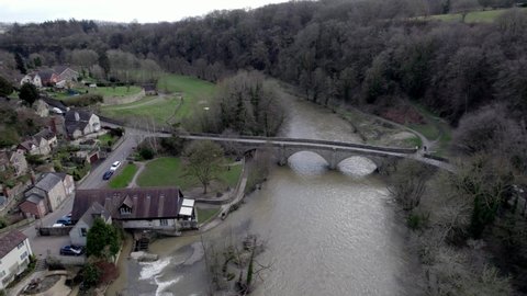 Dinham Bridge over river Teme after heavy rain Ludlow shropshire UK aerial drone view