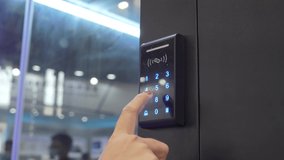 Woman push down electronic control machine with finger scan to access the door of or data center. The concept of data security or data access control. - Powered by Shutterstock - Get 15% off with code: PIKWIZARD15