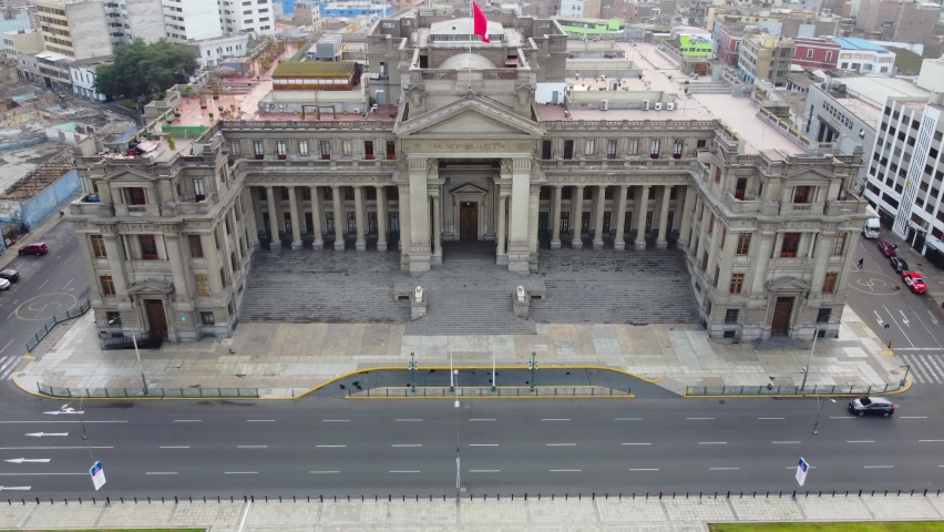 Palace of Justice or "Palacio de Justicia" in Lima, Peru. Drone 4k footage, slowly flying forward. With the Peruvian flag on top.