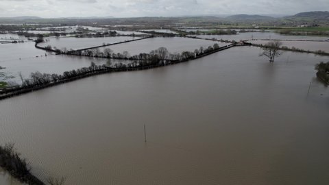 Flooded farm fields after heavy rain England aerial drone view