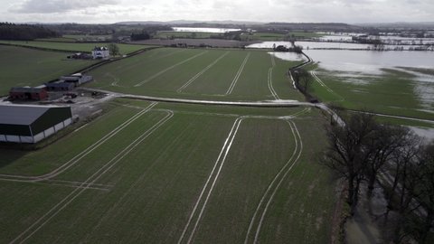 Waterlogged farm fields in UK drone view after storm in winter