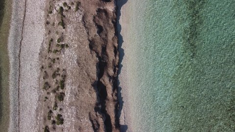 Natural Mediterranean lagoon with crystal blue sea and banks of a seagrass Posidonia, 4K drone footage in Dugi otok, Croatia
