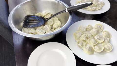 Pelmeni is Russian and Ukrainian national food. It made from dough and beef meat. Boiled in water and usually eat with oil. Pelmeni is handmade homefood. 