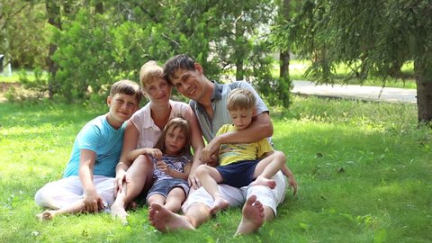 ANAPA, KRASNODAR REGION/RUSSIA - JULE 01: Mom and dad with three kids, a large family in the park on Jule 01, 2015 in Anapa
