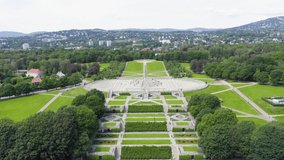 Inscription on video. Oslo, Norway. Public park in the city of Oslo. Aerial view. Appears from the sand, Aerial View, Departure of the camera
