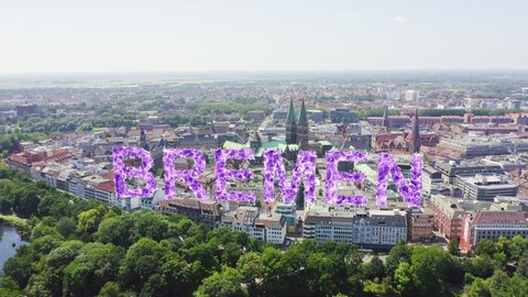 Inscription on video. Bremen, Germany. The historic part of Bremen, the old town. Bremen Cathedral ( St. Petri Dom Bremen ). View in flight. Shimmers in colors purple, Aerial View, Point of interest