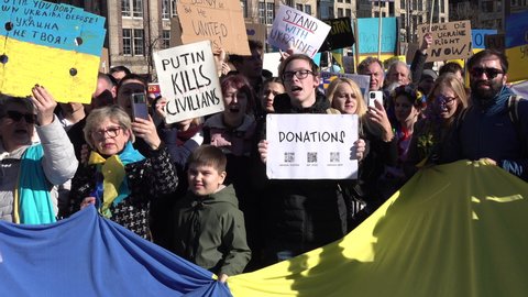 AMSTERDAM, NETHERLANDS – FEBRUARY 27 2022: Ukrainian diaspora and locals attend support demonstration with Ukraine, as people across Europe protest against Russian invasion.