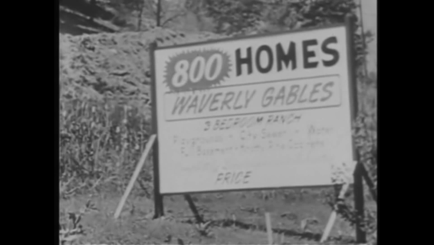 CIRCA 1950s - Images and sounds of family life inside the house with children in the suburbs in 1957.