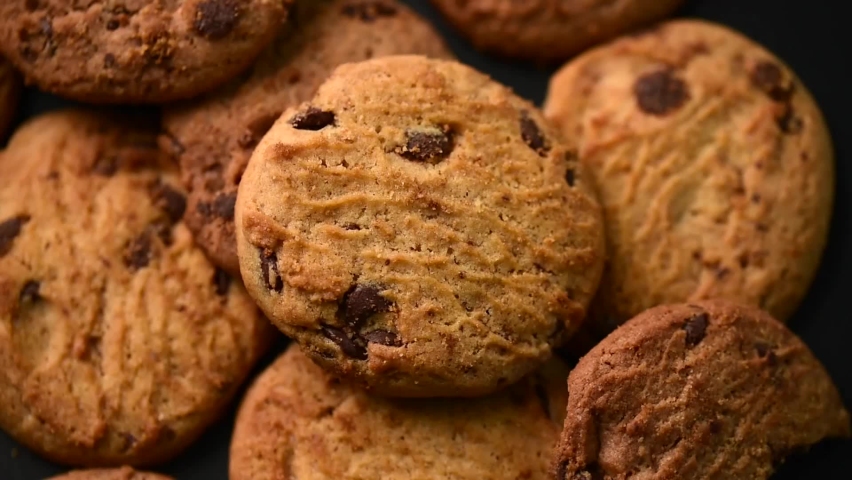Cookies homemade,cookies rotate, piece biscuit chocolate on black  | Shutterstock HD Video #1087888255