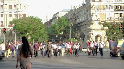 Pedestrians crossing road at Flora fountain, Mumbai, India, Circa 2022 