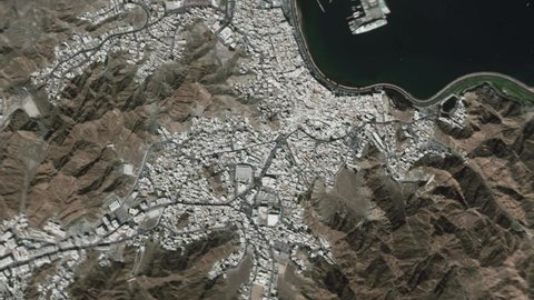 Earth zoom in from space and focus on Mathrah, Muscat, Oman. The animation continues by zoom out through clouds and atmosphere into space. Background for travel intro.