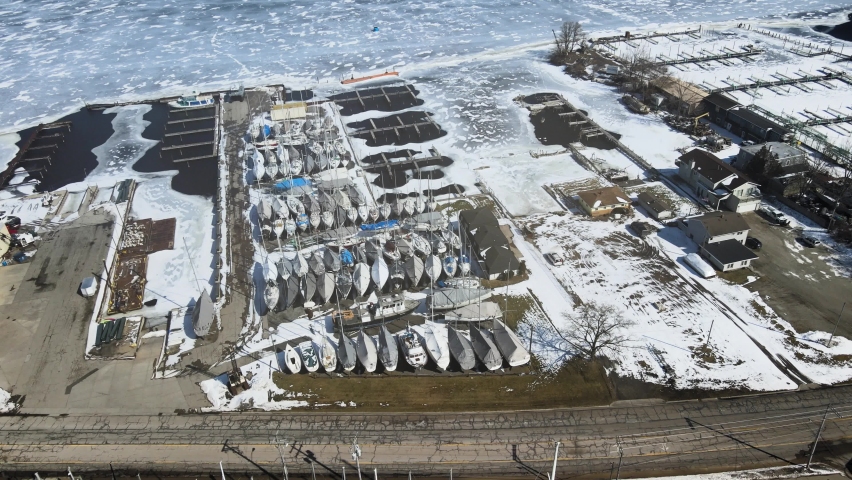 Pan over sailboats winterized and docked in February.