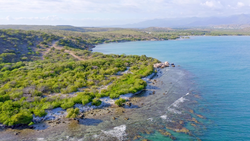 Tropical untouched coastline of Dominican Republic, sunny day, aerial