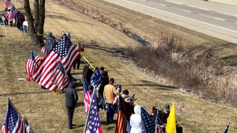 DAYTON, OHIO - MARCH 3: People waiting on Convoy headed to DC to protest vaccine mandates and to show support for re-opening the country, taken in Dayton, Ohio on March 3, 2022.