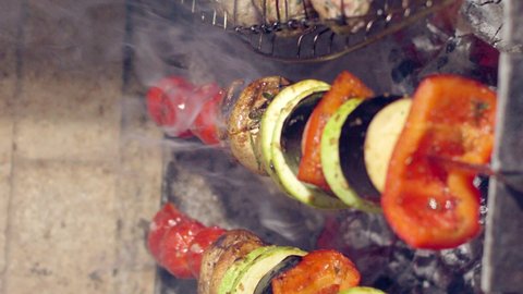 shish kebab on the grill close-up, grilled meat with vegetables, kebab.