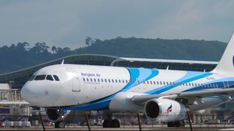 PHUKET, THAILAND - DECEMBER 02, 2018: Airbus 320, HS-PPO Bangkok Airways taxiing on the runway at Phuket international airport (HKT). Tourism and travel concept. Departing flight on a sunny hot day