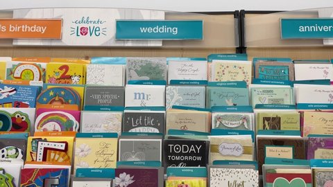 Edmonton, Canada -March 4, 2022: Birthday cards for him on display on shelves in a store