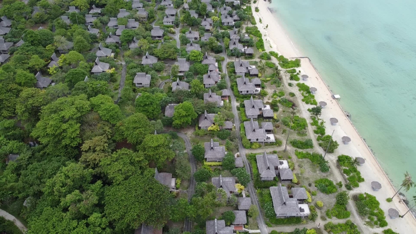 Saii phi phi island village accommodation by the sea on Phi Phi Island Krabi Thailand from an aerial view | Shutterstock HD Video #1087903593