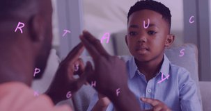 Animation of letters floating over happy african american father and son playing finger games. family, togetherness, spending quality time concept digitally generated video.