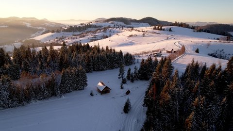 Winter mountain sunset, cottage on the mountain