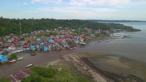 Indonesia, West Sumatra. Drone orbiting around Muara Siberut town and river on Siberut Island, Mentawai.