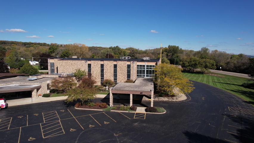Aerial View of Saint Benedict Catholic Church, Fontana-on-Geneva Lake Wisconsin USA on Sunny Fall Day, Dolly Drone Shot