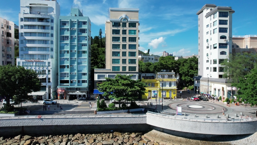 Stanley Market, a coastal town of Hong Kong, with traditional villages, beautiful scenery, water activities, beaches and islands, sea bay, pier and boats in-shore, aerial view