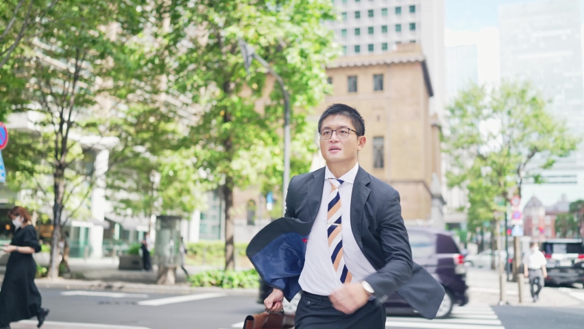 Businessman running in the city Royalty-Free Stock Footage #1087925435