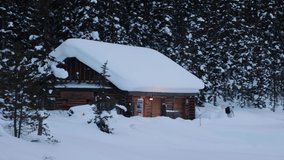 Panning shot Alpine cabin snow covered, banff forest mountains Landscape. Canada - Powered by Shutterstock - Get 15% off with code: PIKWIZARD15