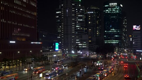 Seoul , South Korea - 02 10 2022: Seoul, South Korea - February 10, 2022: the city skyline above a central bus station at night