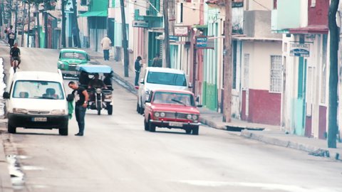 Santa Clara, Villa Clara, Cuba - July 20, 2019: Establishing shot of the traffic and lifestyle in the Maceo Street which is one the most important in the city