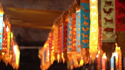 Colorful Zodiac Ceremonial Flags Hanging Outside The Buddhist Temple In Chiang Mai, Northern Thailand. - Selective Focus