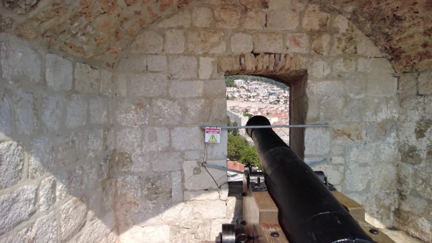 window view with from Fort Lovrijenac cannon, over the West Harbour with Fort Bokar in Croatia. Dubrovnik cityscape, historic city in Dalmatia and UNESCO World Heritage Site.