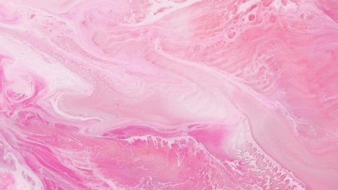 Fluid art painting footage, abstract acryl texture with colorful waves. Liquid paint mixing backdrop with splash and swirl. Detailed background motion with pink, silver and white overflowing colors.