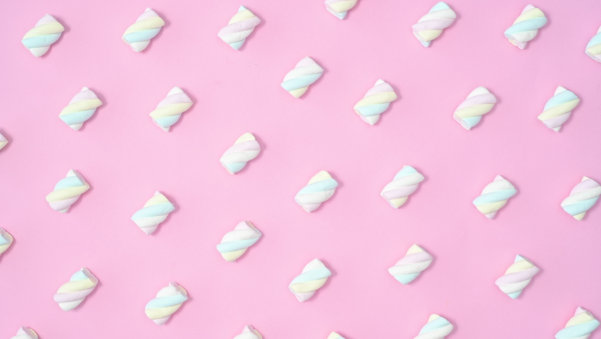6k Creative sweet pattern with marshmallow candies moving on pastel pink background. Stop motion flat lay | Shutterstock HD Video #1087948273