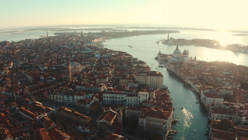 Dolly back establishing drone shot over Central Venice city at sunrise Royalty-Free Stock Footage #1087956861