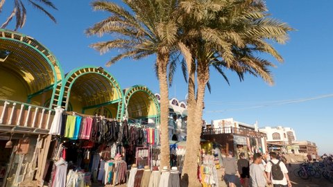 Dahab , Egypt - 02 22 2022: Panning shot Egyptian bazaar on crowded street, touristic location.