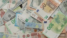 money euro dollar rubles banknotes American flag Russian flag Ukraine flag hands grabbing currency finance cash, consequence of military operation, loss, inflation, sanctions, global economy concept - Powered by Shutterstock - Get 15% off with code: PIKWIZARD15