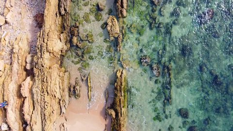 Top view over turquoise deep blue ocean waves. Aerial drone shot over calming beautiful waves. Clear water. Golden sandy beach. Empty beaches. Beautiful sea waves. Water texture. Tourism destination I
