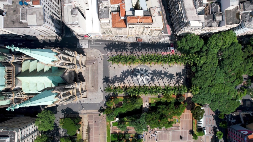 Panning wide of famous catholic church Metropolitan Cathedral of Sao Paulo at ground zero of downtown Sao Paulo Brazil located at Sé Square. Historic medieval building. Religion scenery.