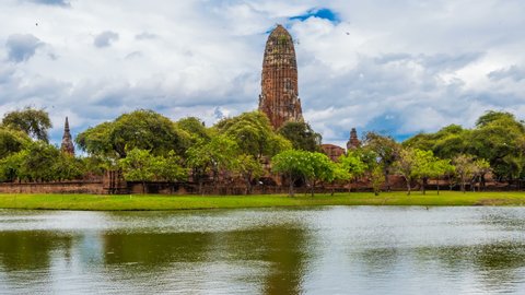 Time Lapse Wat Rama at Ayutthaya Historical Park is an old ancient site, Thailand with reflections of water and many clouds