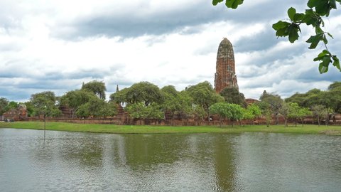Wat Phra Ram at Ayutthaya Historical Park is an old ancient site, Thailand with reflections of water and many clouds