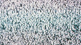 Hand Touches the Screen of the Old Retro TV on Which There is No Signal. Static flickering noise interference, distortion, pixels, bad signal. Black and white noise, artifacts. Interrupted broadcast.