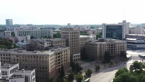 Kharkiv, Ukraine - July 17, 2021: Big Ukrainian city Kharkiv. Derzhprom - big constructivist structure of buildings in Freedom Square, Kharkiv. Aerial wide view