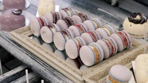 Fresh and delicious pastries macarons laid out on the table for dessert.
