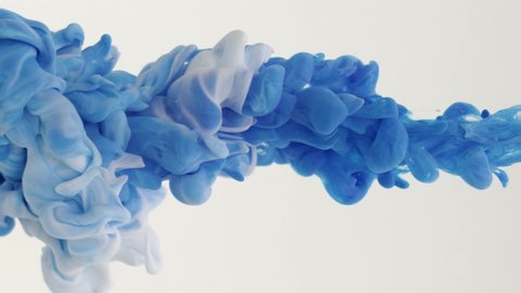 Blue and white paint drops in water on a white background, abstract and beautiful wave of ink. 8K downscale, slow motion. Filmed on cinema camera, 4K.
