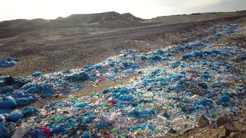 Garbage dump in the desert in Egypt, plastic bottles and various garbage from hotels in the wild